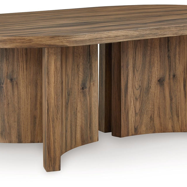 Ashley Austanny Oval Cocktail Table - Warm Brown